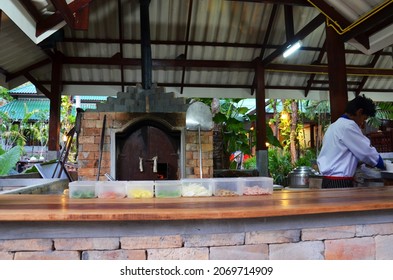 Thai Men Chef People Use Firewood Stove Old Style Cooking Bread Pizza At Restaurant Serve Travelers Guest Customer Eat Drink At Restaurant Shop At Resort Hotel On April 23, 2011 In Krabi, Thailand