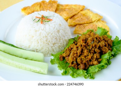 Thai Minced Pork With Spicy Yellow Paste Served With Rice And Omelet