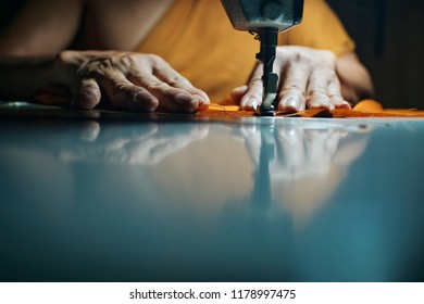 A Thai Monk Sewing A Robe For Kathina Ceremony.