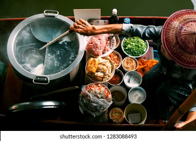 thai noodle food making on floating boat in floating market thailand - Shutterstock ID 1283088493