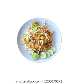 Thai noodles with shrimp and vegetables are located on a white background. Thai food, Pad Thai in a bowl isolated on white background.