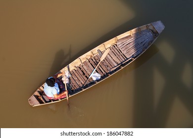 thai old woman sailing boat in top view