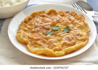 Thai Omelette On A White Plate.