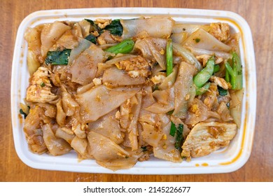 Thai Pad See Ew With Chicken In A Takeout Container