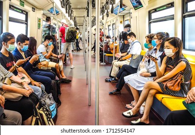 Thai People And Foreign Travelers Are Wearing Medical Face Mask While Traveling On BTS Public Transportation To Protect Themselves From Pandemic Coronavirus Covid-19, Bangkok, Thailand, 25 March 2020