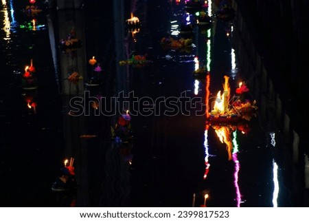 Thai people travel visit join Loy Krathong festival celebrate and bring beautiful Krathong ritual floating river for forgiveness from Ganges angel or Khongkha Goddess of water in Nonthaburi, Thailand