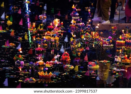 Thai people travel visit join Loy Krathong festival celebrate and floating ritual vessel at river for forgiveness from Ganges angel or Khongkha Goddess of water at Bangbuathong in Nonthaburi, Thailand