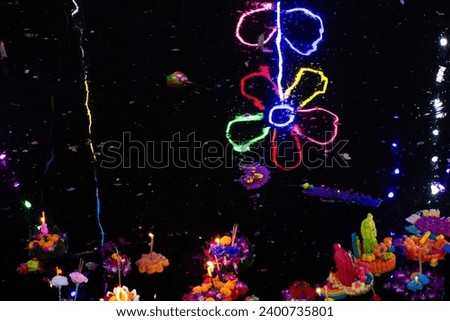 Thai people travel visit join Loy Krathong festival celebrate and floating ritual vessel at river for forgiveness from Ganges angel or Khongkha Goddess of water at Bangbuathong in Nonthaburi, Thailand
