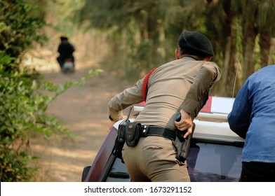 
The Thai Police On The Royal Thai Police Car Chase To Arrest The Culprits  Outrun The Police By Motorcycle On The Local Road.