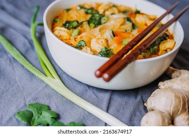 Thai Red Curry Noodle Soup With Chicken In A Bowl