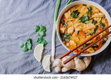 Thai Red Curry Noodle Soup With Chicken In A Bowl