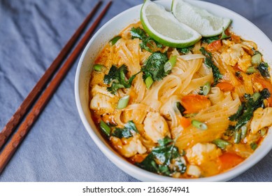 Thai Red Curry Noodle Soup With Chicken In A Bowl