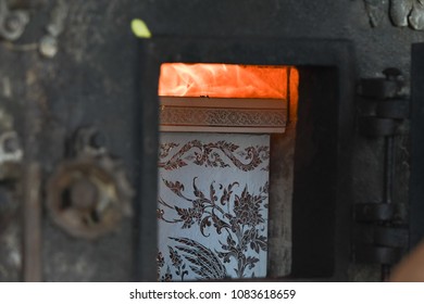 Thai Religious Ritual For The Cremation. The Corpse In The Coffin Is Burning In The Cremate.