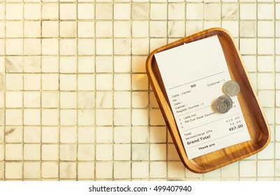 Thai Restaurant Bill Payment Receipt On White Marble Tile Table Top