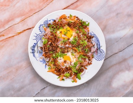 Thai salad made with fried egg. Yam khai dao is a Thai dish made out of fried chicken or duck eggs. It is an easy to prepare food, but it cannot usually be purchased in restaurants.