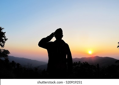 Thai Soldier Saluting With Sunset Background,Silhouette 