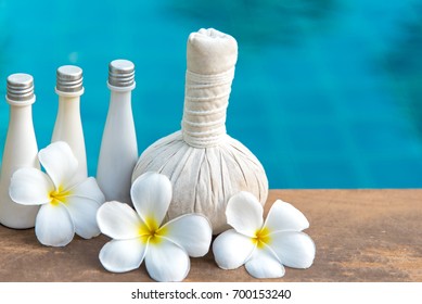 Thai Spa massage compress balls, herbal ball and treatment  spa, relax and healthy care with frangipani white flower, Thailand.  Healthy Concept