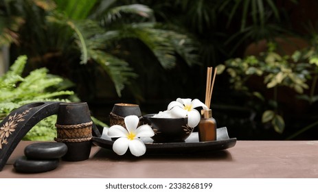 Thai spa massage. Spa treatment cosmetic beauty. Therapy aromatherapy for care body women with candles for relax wellness. Aroma and salt scrub setting ready healthy lifestyle, copy space for banner - Powered by Shutterstock