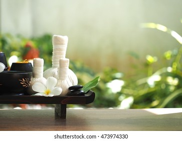 Thai Spa massage, treatment and herbal ball with candle compress spring water. Thailand.  Healthy Concept