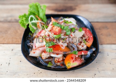 Thai spicy mix salad with pork.