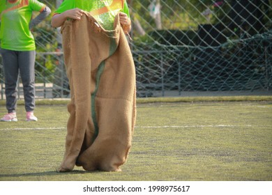 Thai sport sack running or sack race in soccer field - Powered by Shutterstock