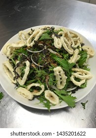 Thai Squid Salad On Metal Bench Top