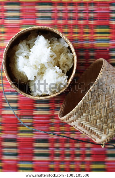 Thai sticky rice in a bamboo wooden old fashioned style box isolated