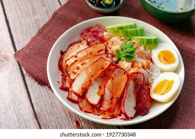 Thai Street Food - Barbecued Red Pork With Boiled Eggs And Rice Covered Sweet Sauce