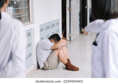 Thai student bullying victim by classmates crying sadly being bullied, concept of being bullied by schoolmates causing stress and physical and psychological harm.
 - Powered by Shutterstock