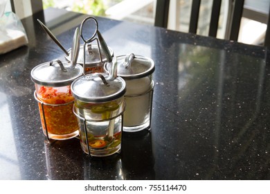 Thai Style Condiments At The Restaurant Table