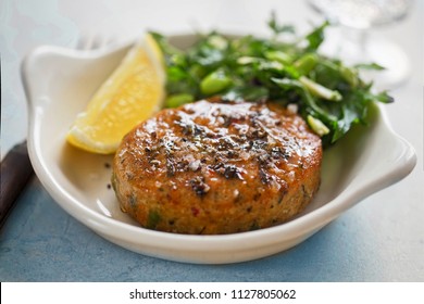 Thai Style Fish Cakes With Spicy Soy Glaze, Green Salad And Lemon Wedge 
