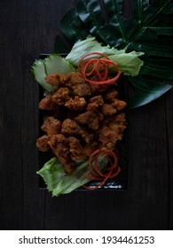 Thai Style Fried Pork Flatlay On Wooden Table. Asian Garlic Pork Rustic Shoot Dark Food Photography With Copy Space.