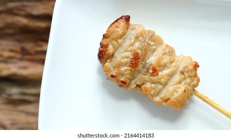Thai style  grilled pork on a white plate background