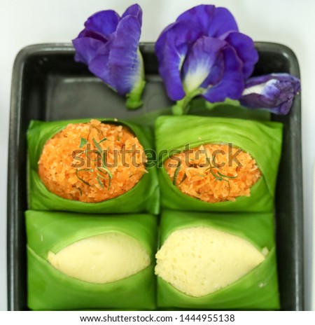 Thai style sweet desserts Two types on sticky rice, Sank ka ya made from eggs and coconut milk and shrimp and shred coconut orange color Stock fotó © 