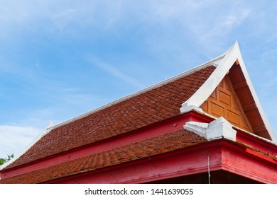 Thai Temple roof top with blue sky.