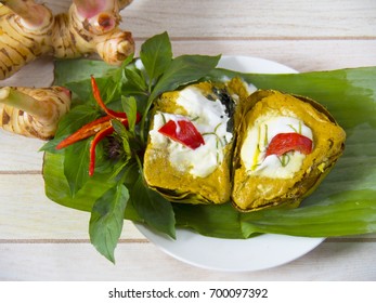 Thai Traditional Food Steamed Fish With Curry Paste On Bannana Leaf.