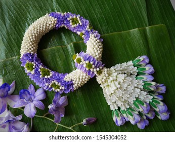 Thai traditional garlands known as Malai. They are made by stringing together various flower combinations usually jasmine buds ,orchid ,crown flowers and roses.