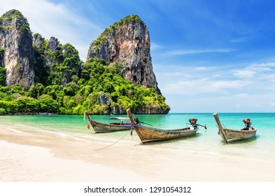 Thai traditional wooden longtail boat and beautiful sand Railay Beach in Krabi province. Ao Nang, Thailand. - Shutterstock ID 1291054312