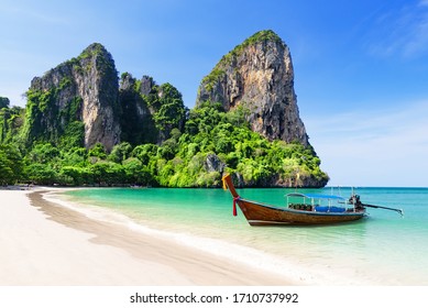 Thai traditional wooden longtail boat and beautiful sand Railay Beach in Krabi province. Ao Nang, Thailand. - Shutterstock ID 1710737992