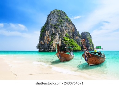 Thai traditional wooden longtail boat and beautiful sand Ao Phra Nang Beach in Krabi province. Ao Nang, Thailand. Travel summer concept. - Powered by Shutterstock