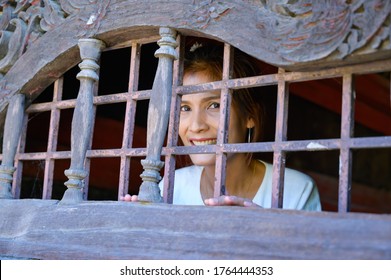 Thai Woman At Clerestory, Chiang Mai.