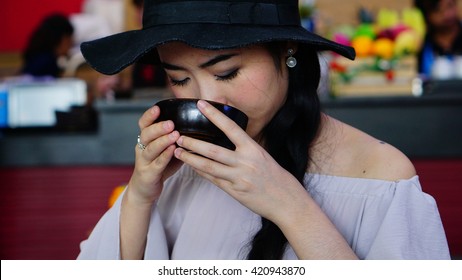 Thai Woman  Eating With Soup.