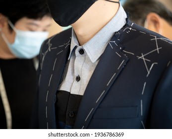 Thailand Bangkok 2021 march 16 Customer wear mask come to fitting bespoke custom suit during coronavirus situation at tailor shop