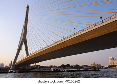 Thailand, Bangkok, view of the Rama VIII Bridge and the Chao Praya river at sunset