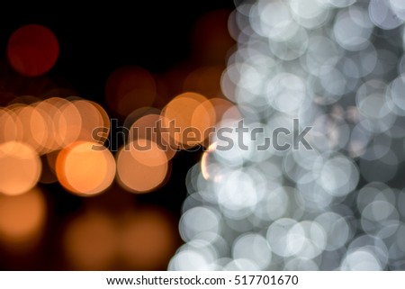 Thailand Christmas fair - out-of-focus bokeh background with illuminated snowflakes and christmas tree