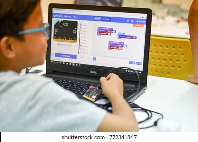 Thailand, December, 2017. The young Asian boy is coding to make his program my pets project via micro bit, the future skills for young child in the coding for kids classroom in Thailand.