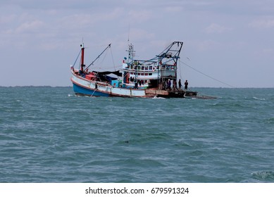 Thailand - July 2017 : Thai Fishing Boat With Fishermen Capturing Fish And Other Animals On The Gulf Of Thailand. A Lot Of Migrant Workers From Cambodia And Myanmar Are Labor In Thai Fishing Industry.