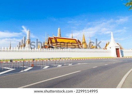 Thailand on street and background of Wat Phra Kaew (Temple of the Emerald Buddha).