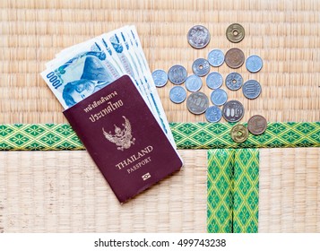Thailand passport put together with Japanese coins and banknote  - Shutterstock ID 499743238