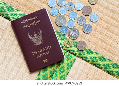 Thailand passport put together with Japanese coins and banknote  - Shutterstock ID 499743253